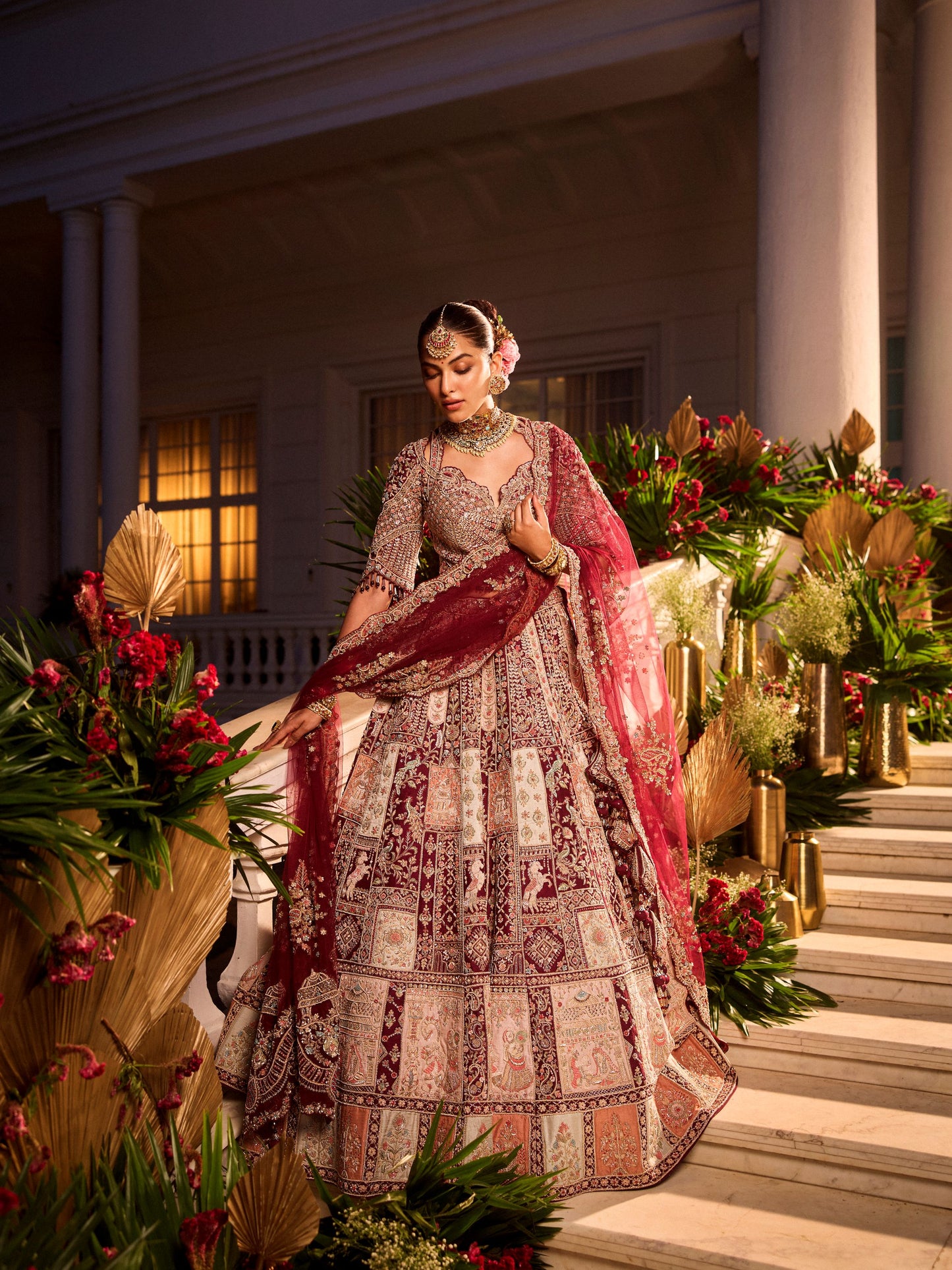 Wine Colour Bride And Groom Motif Hand Embroidered Bridal Lehenga