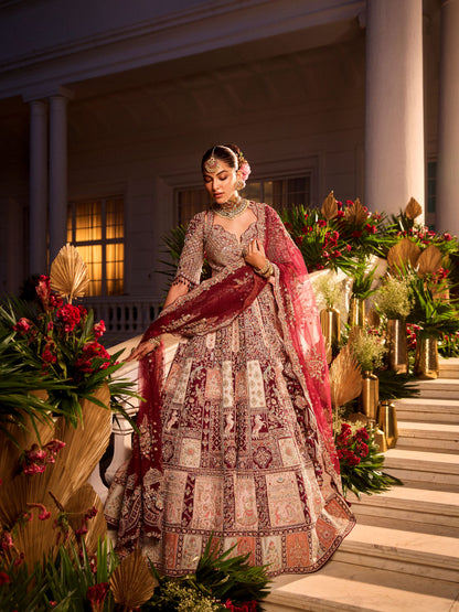 Wine Colour Bride And Groom Motif Hand Embroidered Bridal Lehenga