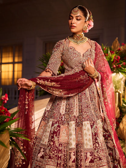 Wine Colour Bride And Groom Motif Hand Embroidered Bridal Lehenga