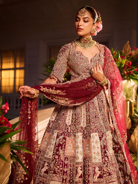 Wine Colour Bride And Groom Motif Hand Embroidered Bridal Lehenga