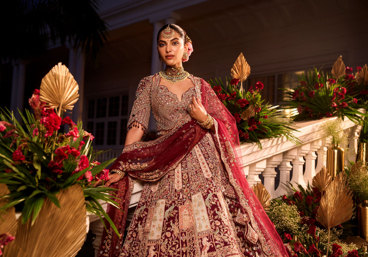 Wine Colour Bride And Groom Motif Hand Embroidered Bridal Lehenga