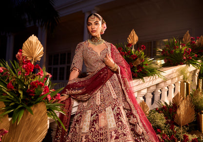 Wine Colour Bride And Groom Motif Hand Embroidered Bridal Lehenga