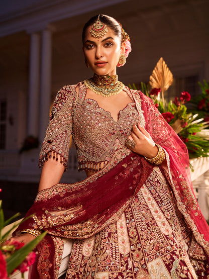 Wine Colour Bride And Groom Motif Hand Embroidered Bridal Lehenga