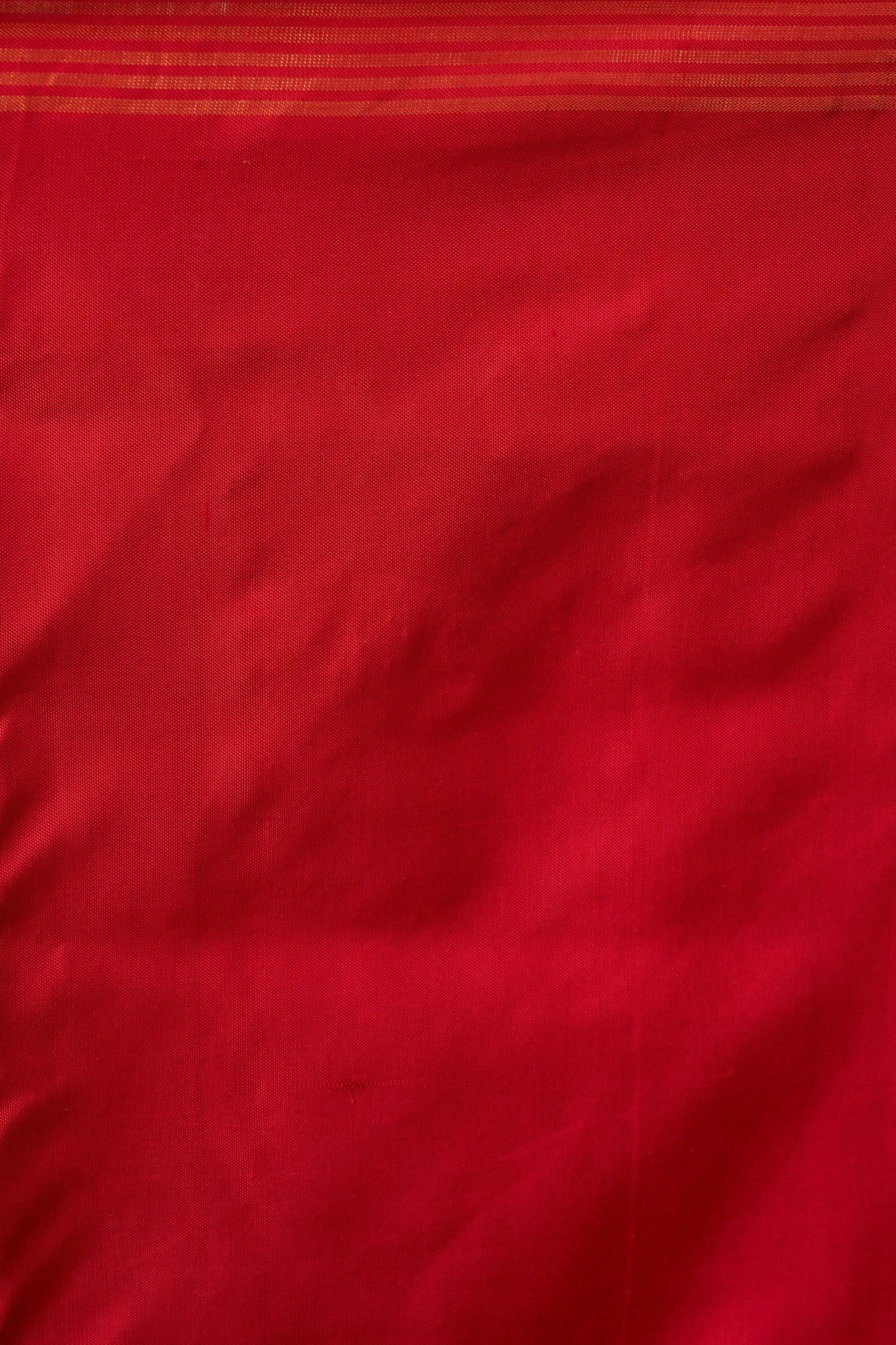 Crimson Red Patola Silk Weave Saree With Golden Zari Piping