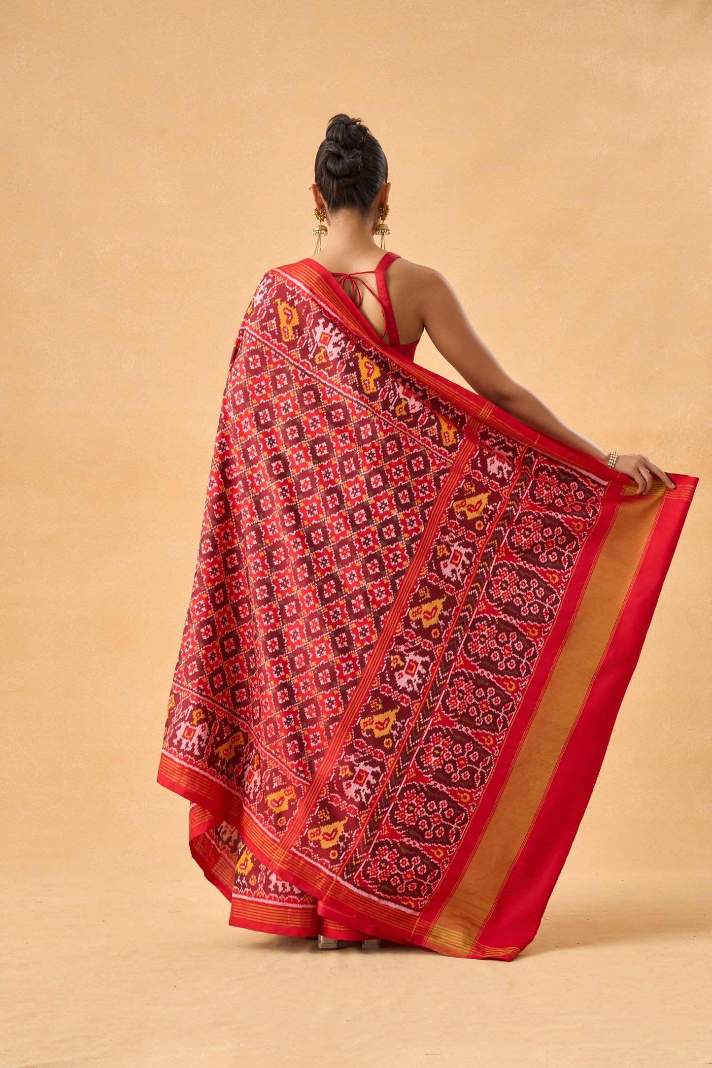 Crimson Red Patola Silk Weave Saree With Golden Zari Piping