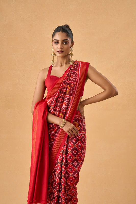 Crimson Red Patola Silk Weave Saree With Golden Zari Piping