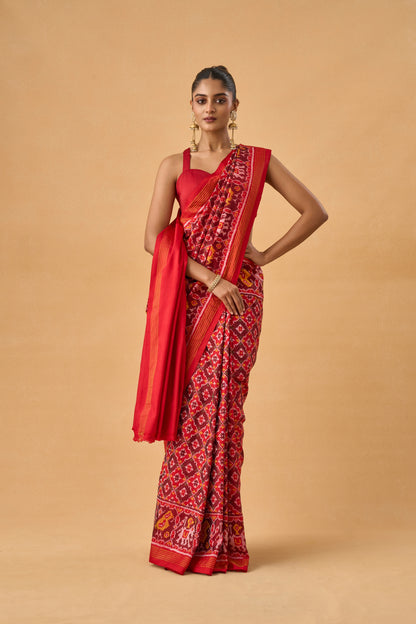 Crimson Red Patola Silk Weave Saree With Golden Zari Piping