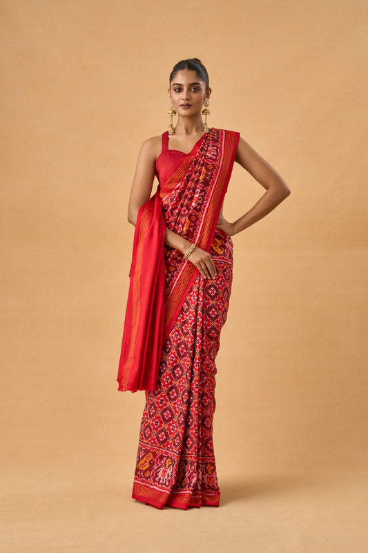 Crimson Red Patola Silk Weave Saree With Golden Zari Piping